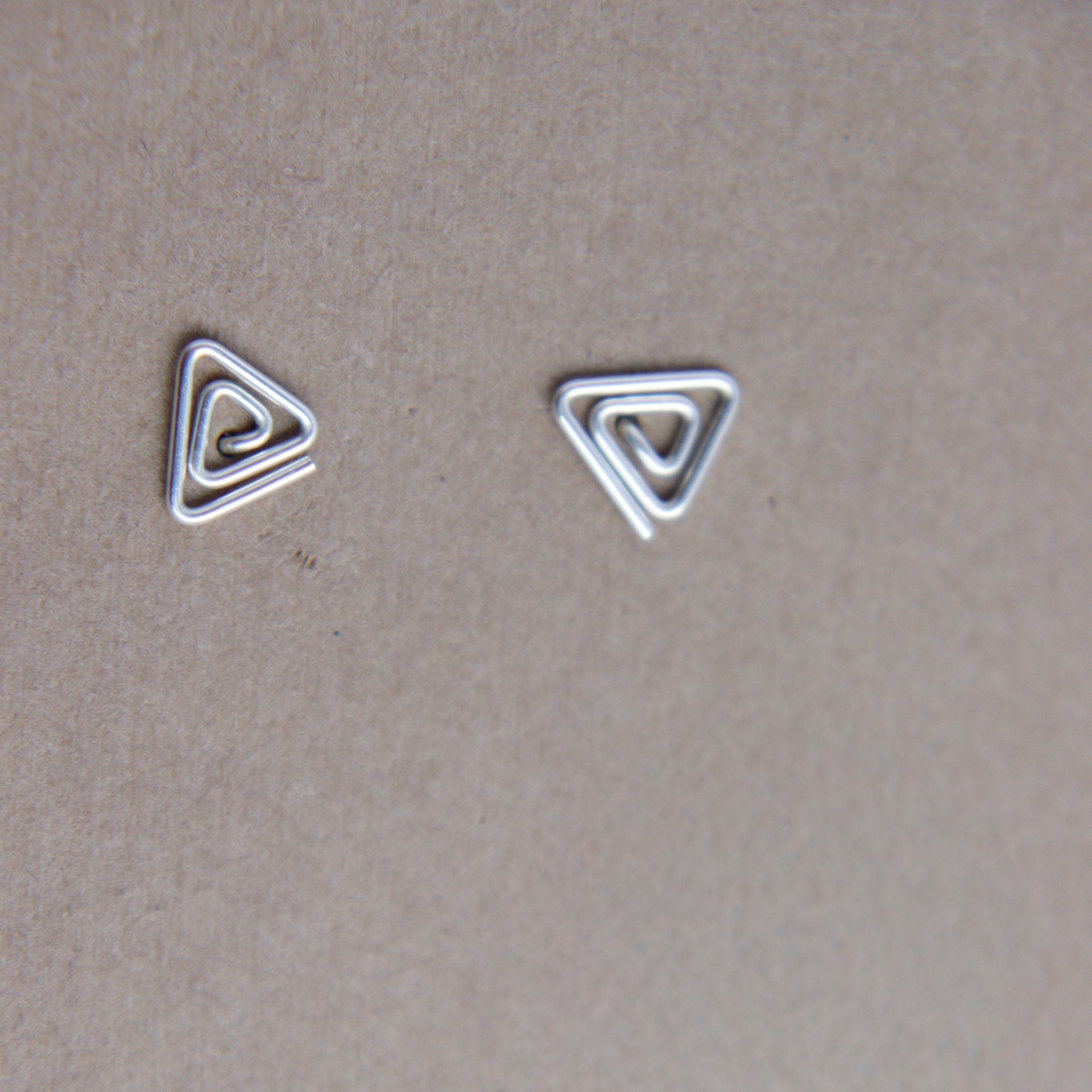 Triangle swirl studs