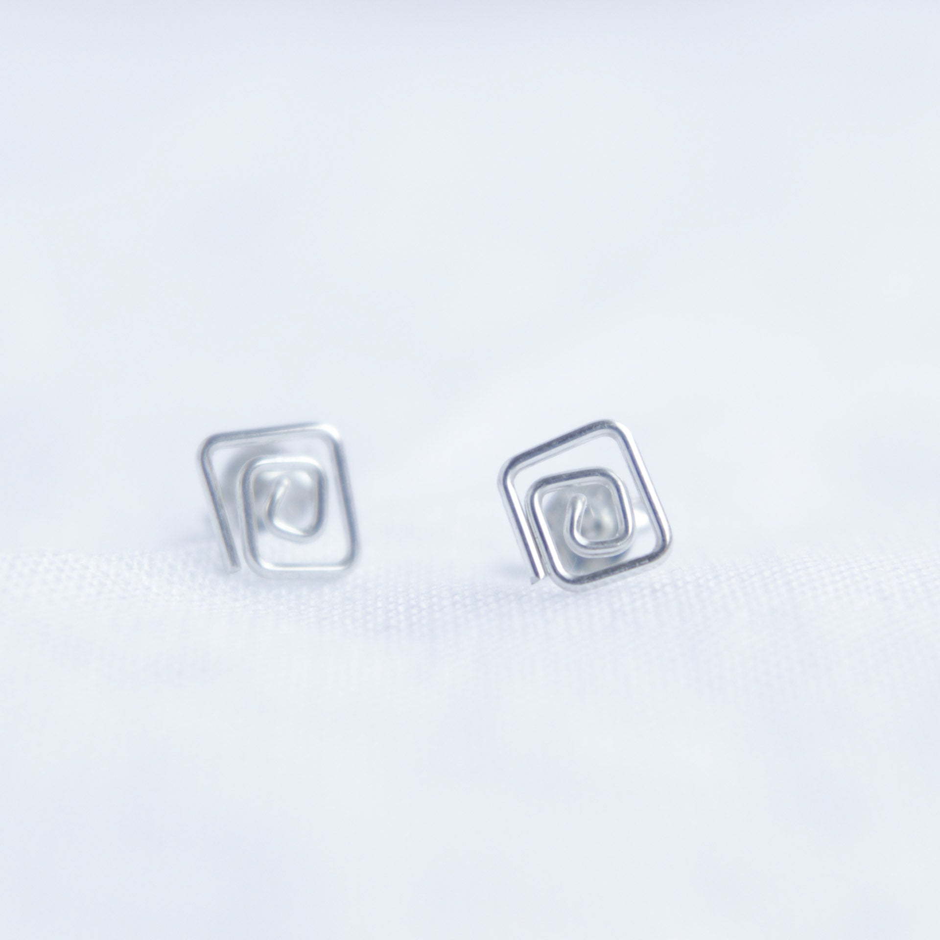 Square swirl studs