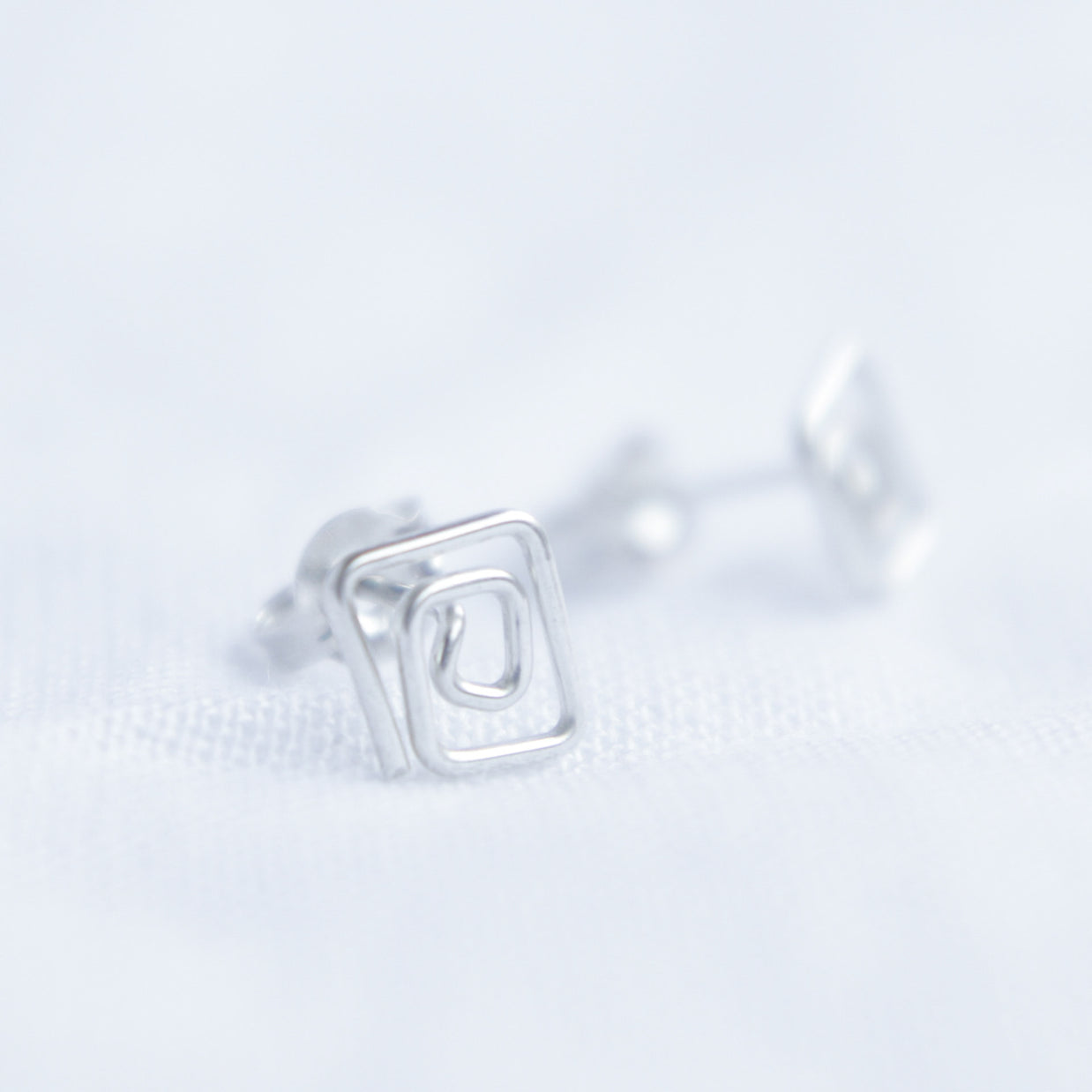 Square swirl studs