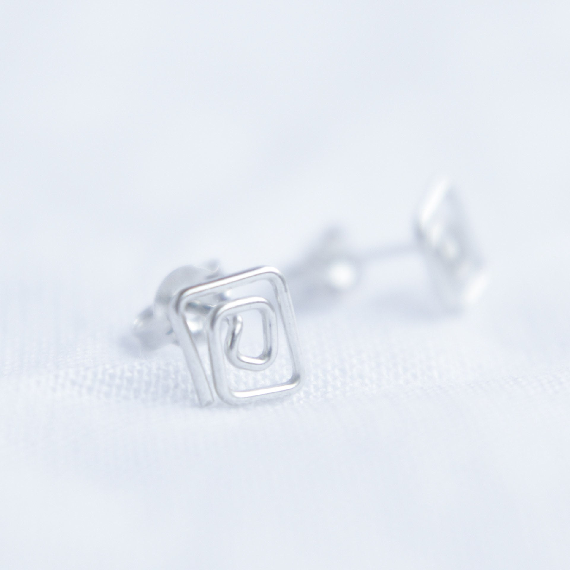 Square swirl studs